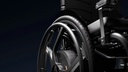 Side view of an Empulse M90 wheel beside the seat and frame