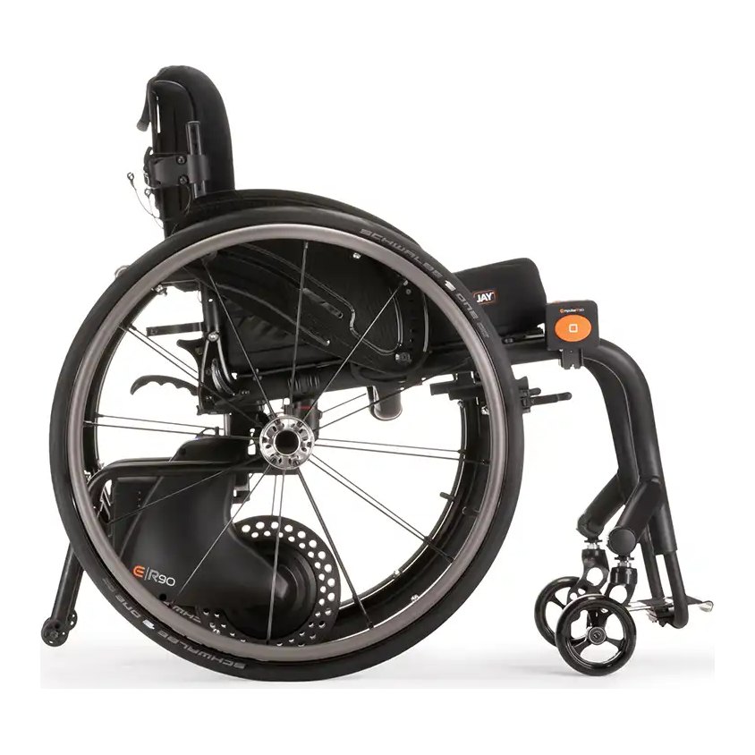 Empulse R90 rear-mounted push assist. Side view of the Empulse R90 under a rigid chair, drive wheel down