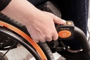 Hand on the Empulse R90 control box, plus button and orange mode key