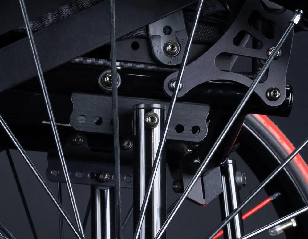 Centre-of-gravity plates and axle hardware on a black RGK AllCourt