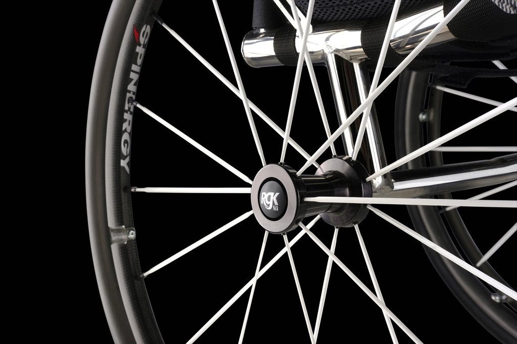 Close view of the axle tube, spokes and Sub4 rim on an RGK Octane wheelchair