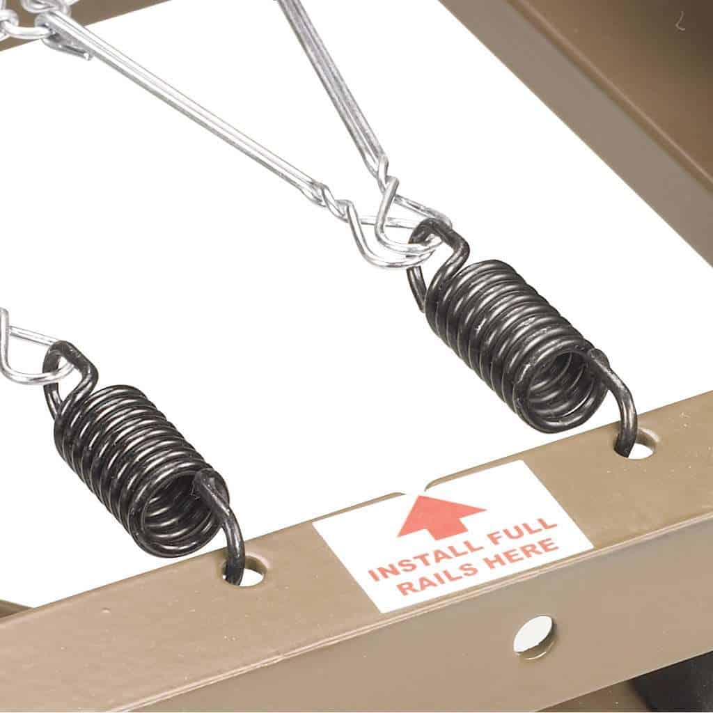 Zinc-coated spring deck of the Delta 15235, with the label marking where full-length rails fit