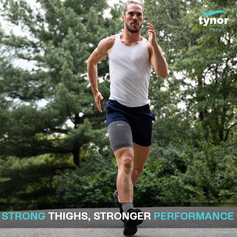 Runner wearing a Tynor Thigh Support on his thigh while running outdoors