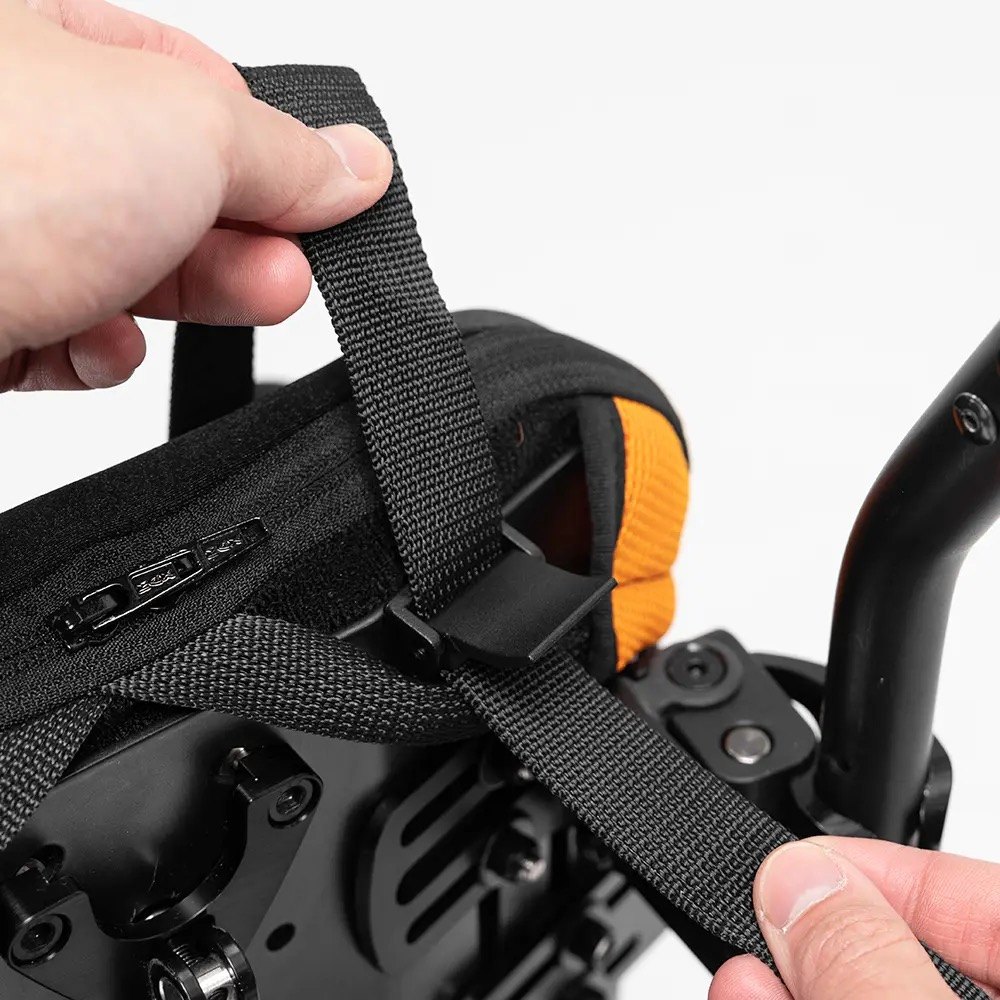 The chest harness strap and buckle on the Wonderseat seat