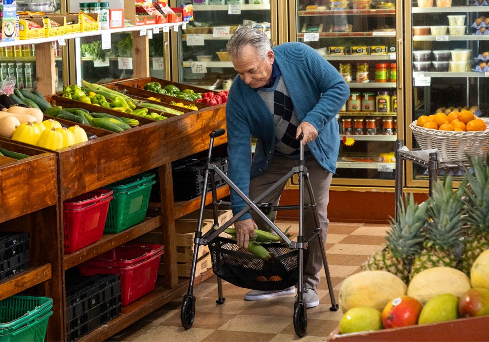 Person putting produce into the basket of a two-wheel walker