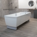 Avero Comfort tub in a tiled bathing room, beside a wall rail and a hand shower