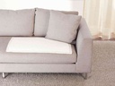 A Depend Night Defense underpad laid on a sofa cushion