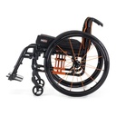 Quickie QS5 X ultralight folding wheelchair seen from the rear at an angle, orange frame and black wheels