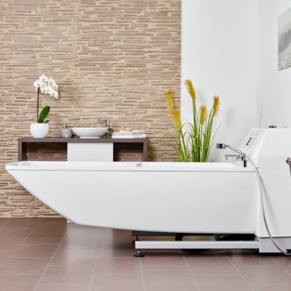 The Avero Premium Plus care tub seen from the side with the console at the foot