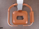 The Eve comfort seat seen from above, showing the large hygiene opening in the orange pad