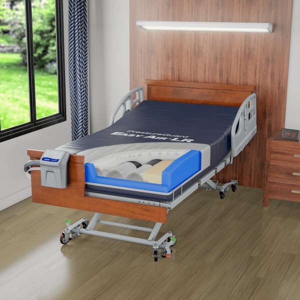 PressureGuard Easy Air LR on a bed, navy cover open, control unit at the side.
