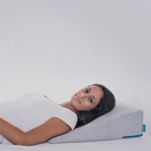 The Symbia 14 shoulder wedge set against the upper back with a pillow under the head