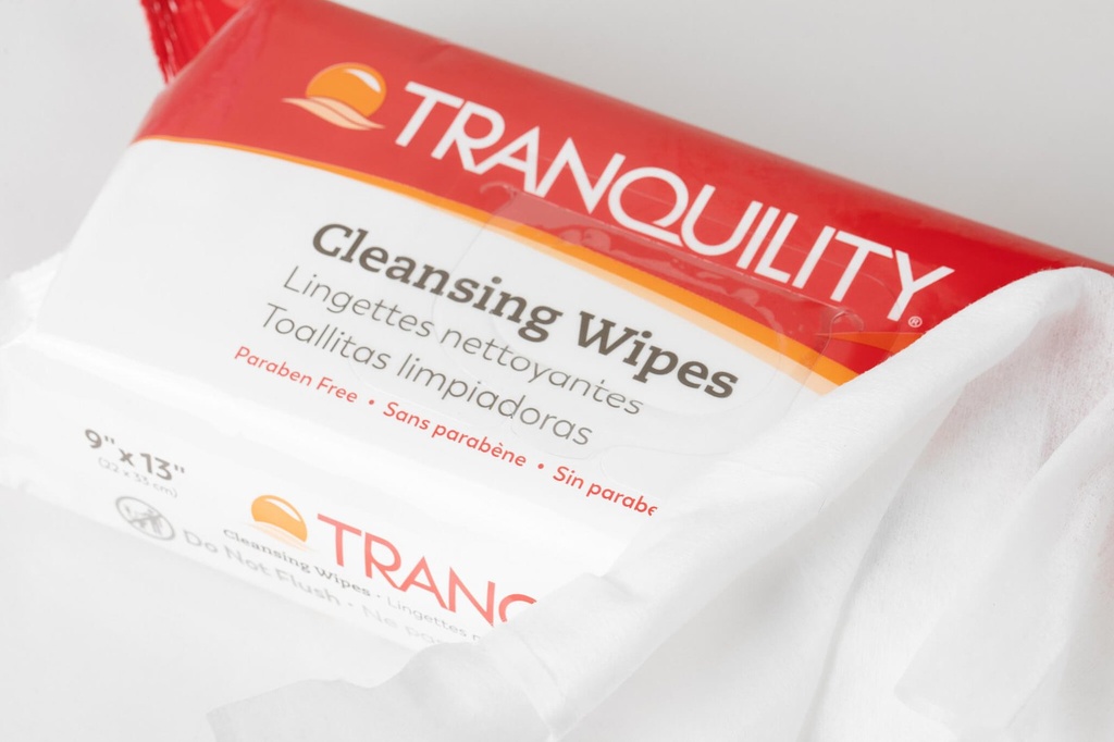 Close-up of the Tranquility Cleansing Wipes label beside a folded 9 x 13 inch wipe
