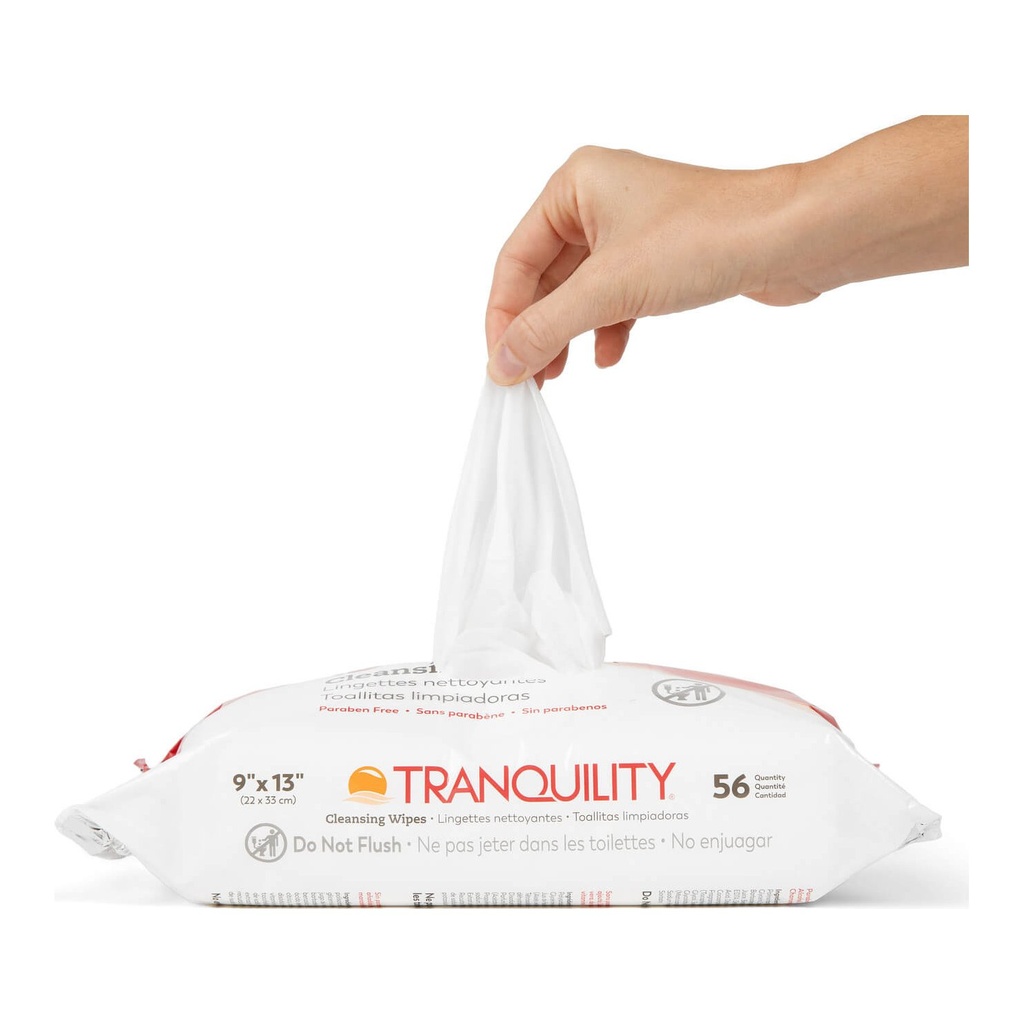 A hand pulling one wipe from the 56 count Tranquility Cleansing Wipes pack