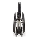 Catalyst 5Ti titanium folding wheelchair folded and seen from the front, showing how narrow it packs