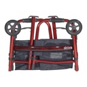 The same red walker folded flat with its legs clipped into the frame and the two pouches still fitted