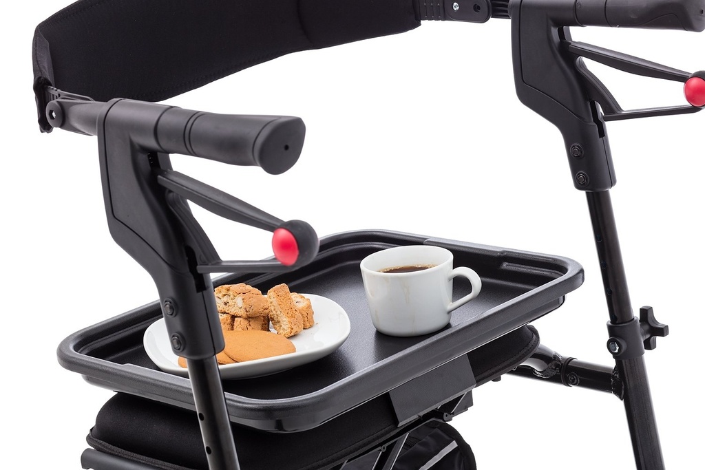 The neXus tray holding a mug and a plate on a neXus rollator