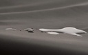 Close-up of water beading on the dark Dartex-coated cover of the JAY GO cushion