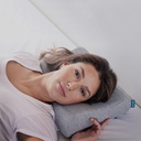 Person lying on their side with the Orthex Somnia 3.5 pillow under the neck