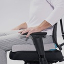 Person seated on the Orthex Symbia 2.5 seat cushion in an office chair