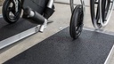 Wheelchair wheels on the black applied surface of the EZ-ACCESS SUITCASE AS ramp