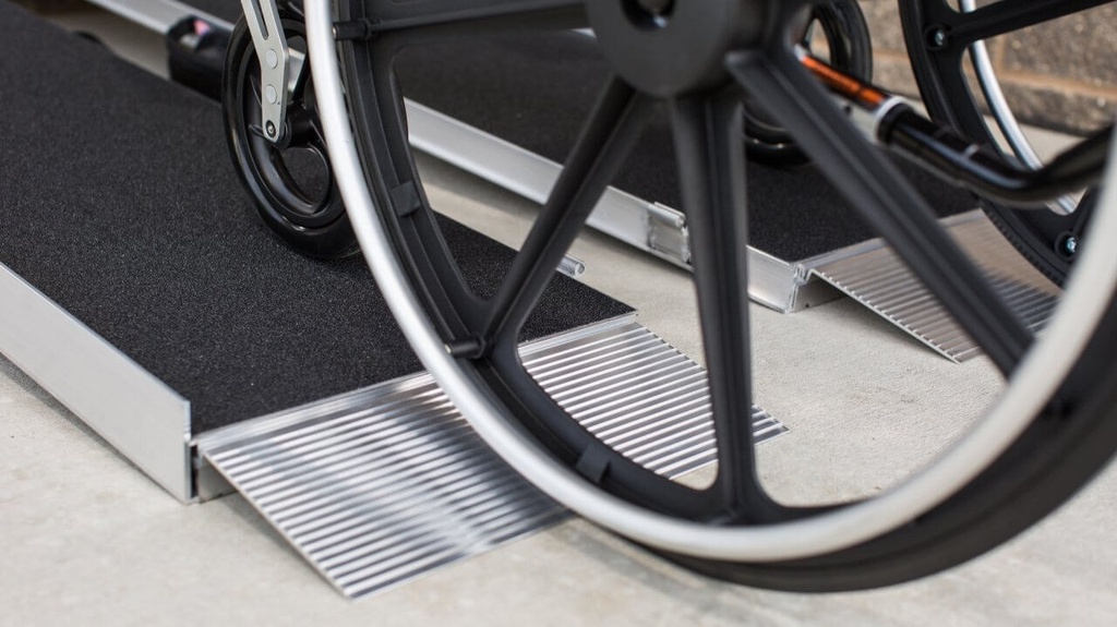 Wheelchair wheel on the aluminium bottom transition plate of the SUITCASE AS ramp