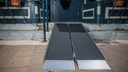 SUITCASE Singlefold AS ramp set up as two sections over a porch step