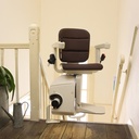 Freecurve chair parked at the top of a staircase beside its curved rail