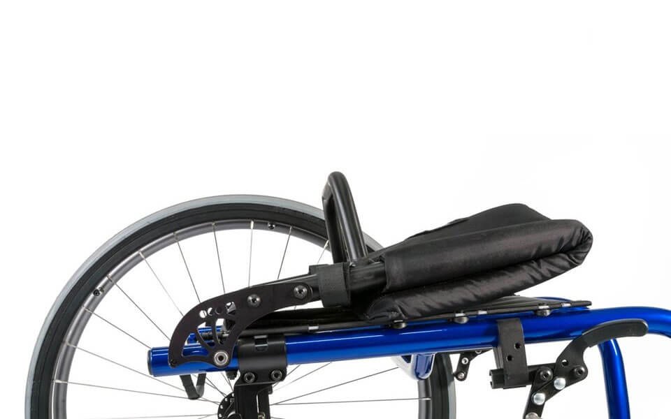 Quickie QRi rigid wheelchair rear corner, showing its axle plate, folding back and rear wheel