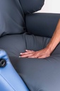 Close view of the K-Care Air Comfort Chair seat and a hand