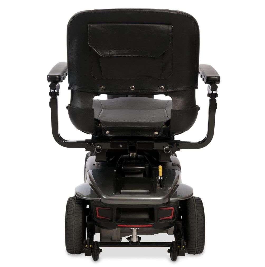Rear of the Grey Street Revo 2.0 showing the seat-back pocket, rear bumper with red reflectors and anti-tip wheels