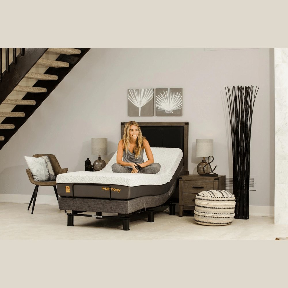 Person seated on a Harmony 3 adjustable base set close to flat