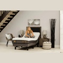 Person seated on a Harmony 3 adjustable base set close to flat