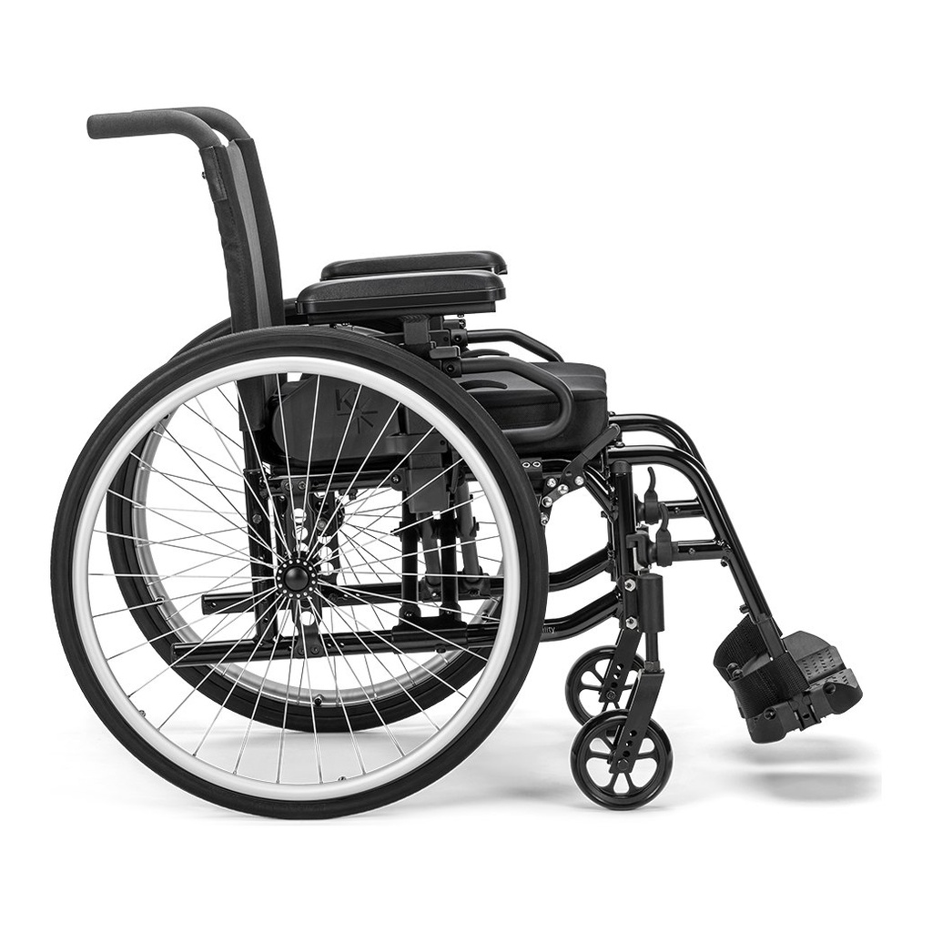 Catalyst 4E wheelchair from the side, showing its rear wheel, arm pad, axle plate and caster