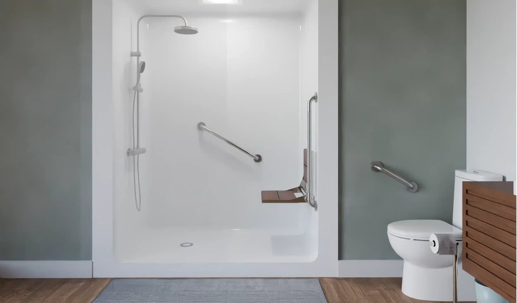 Knurled bars on a walk-in shower wall and beside a toilet