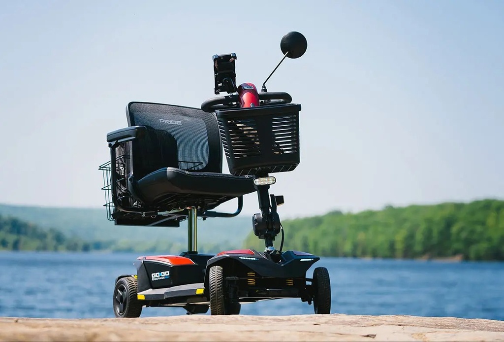 Garnet Red Endurance AL Plus by a lake, with an optional rear basket, mirror and phone holder