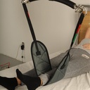 One quilted band under the lower leg, with the strap on the carry bar hook