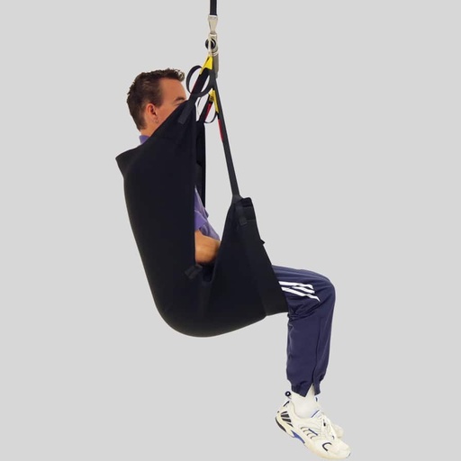 Person reclined in a black In-Situ Recline sling, side view, with yellow loop straps