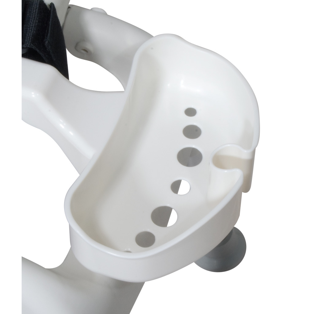 Close view of the white soap dish with drain holes beside the seat belt