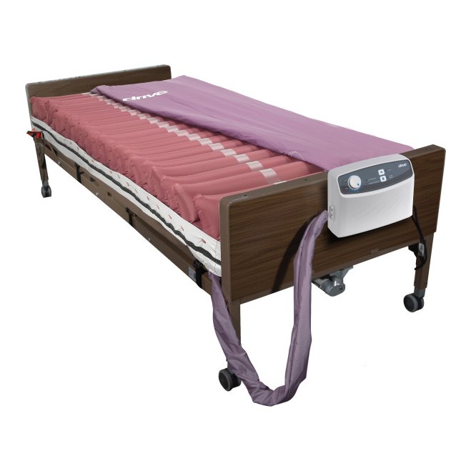 Drive Med-Aire mattress and pump on a hospital bed, cover folded back; the bed is a separate rental