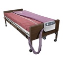 Drive Med-Aire mattress and pump on a hospital bed, cover folded back; the bed is a separate rental