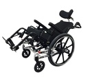Example manual tilt wheelchair with a headrest and elevating legrests, seat tilted back