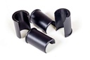 Four black plastic spacer sleeves from the hardware kit that reduce the cane clamps to 7/8 or 3/4 inch posts
