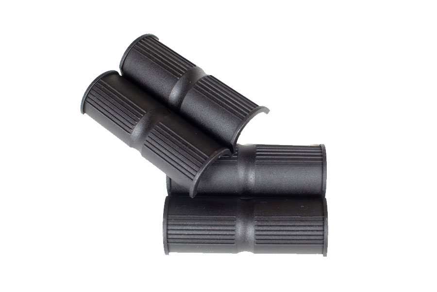 Four ribbed black cane inserts that fit inside the cane clamps on the wheelchair's back posts