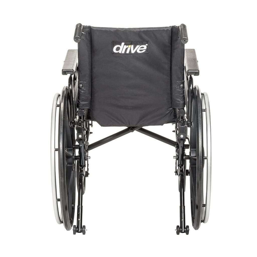 Rear view showing the back upholstery, the push handles and the folding cross brace